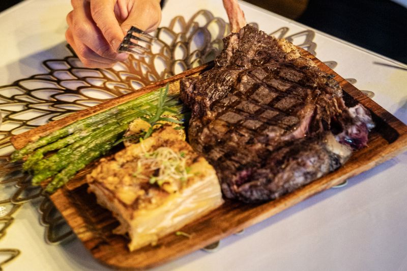 Premium Tomahawk steak dinner at the Pisco Signature Dinner Steak & Wine Experience in Charlotte